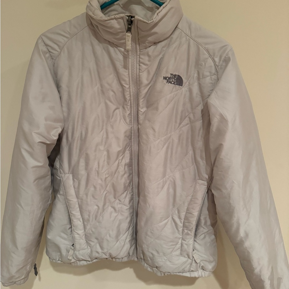 Woman’s Pearly White North Face Jacket